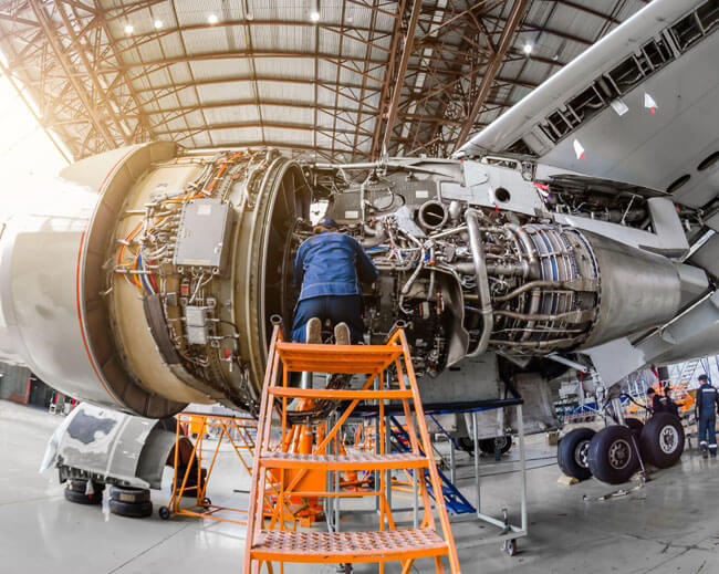 A person working on a jet engine