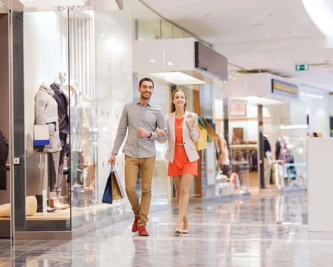 A couple walking in a shopping centre