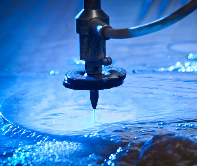 A water jet cutter in action